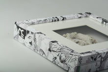 Load image into Gallery viewer, Square box frame covered with asian comics and porcelaneous stonewear wreath within. ''Maypole''