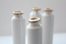 Load image into Gallery viewer, Small white bottle with gold finish from bone china.