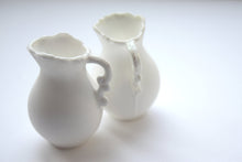 Load image into Gallery viewer, Mini jug made from pure white fine bone china and mother of pearl rim and handle in stoneware