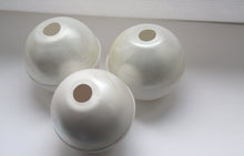 Load image into Gallery viewer, White spheres made from fine bone china with mat ivory mother of pearl on the top half