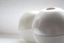 Load image into Gallery viewer, White spheres made from fine bone china with mat ivory mother of pearl on the top half