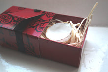 Load image into Gallery viewer, Red gift box matchbox style with black floral pattern and ribbon