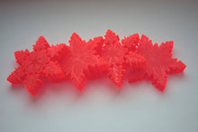Load image into Gallery viewer, Orange snowflakes laser cut and engraved from thick acrylic in two limited edition designs