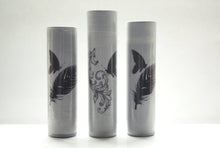 Load image into Gallery viewer, Bud vase made from gray earthenware with glossy effect and a butterfly on a feather