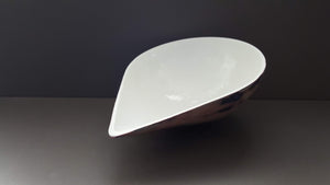 English fine bone china stoneware bowl with a unique patterned surface and unusual shape.