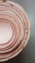 Load image into Gallery viewer, Set of 7 stoneware fine bone china nesting bowls in dusty pink and white with various finishes.