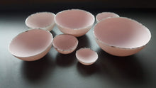 Load image into Gallery viewer, Set of 7 stoneware fine bone china nesting bowls in dusty pink and white with various finishes.