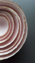 Load image into Gallery viewer, Set of 7 stoneware fine bone china nesting bowls in dusty pink and white with various finishes.