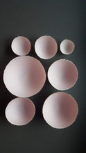 Load image into Gallery viewer, Set of 7 stoneware fine bone china nesting bowls in dusty pink and white with various finishes.