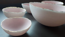 Load image into Gallery viewer, Set of 7 stoneware fine bone china nesting bowls in dusty pink and white with various finishes.