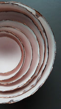 Load image into Gallery viewer, Set of 7 stoneware fine bone china nesting bowls in dusty pink and white with various finishes.