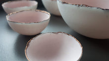 Load image into Gallery viewer, Set of 7 stoneware fine bone china nesting bowls in dusty pink and white with various finishes.