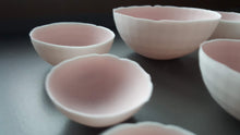 Load image into Gallery viewer, Set of 7 stoneware fine bone china nesting bowls in dusty pink and white with various finishes.