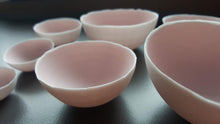 Load image into Gallery viewer, Set of 7 stoneware fine bone china nesting bowls in dusty pink and white with various finishes.