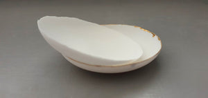 Small shallow dishes from stoneware fine bone china in pure white or with shimmering gold finish, stoneware porcelain, white ceramic,