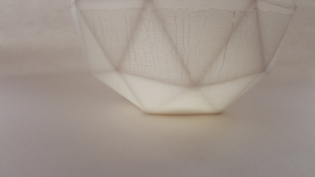 Geometric faceted polyhedron white candle holder made from fine bone china with real gold finish