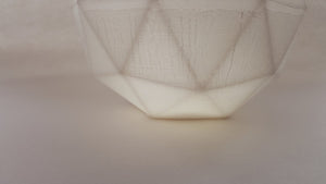 Geometric faceted polyhedron white candle holder made from fine bone china in organic finish