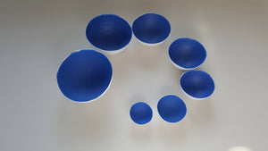 Set of 7 stoneware fine bone china nesting bowls in blue and white.