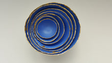 Load image into Gallery viewer, Set of 7 stoneware fine bone china nesting bowls in blue and white with real gold finish.