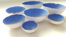 Load image into Gallery viewer, Set of 7 stoneware fine bone china nesting bowls in blue and white with real gold finish.