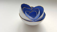 Load image into Gallery viewer, Set of 7 stoneware fine bone china nesting bowls in blue and white with real gold finish.