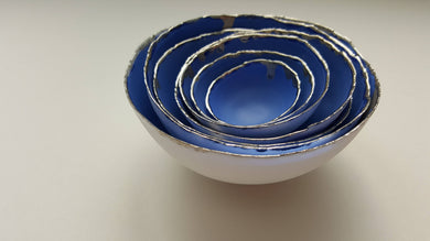 Set of 7 stoneware fine bone china nesting bowls in blue and white with real platinum finish.