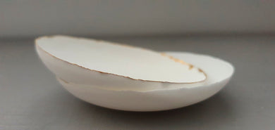 Small shallow dishes from stoneware fine bone china in pure white with shimmering gold finish, stoneware porcelain, white ceramic,