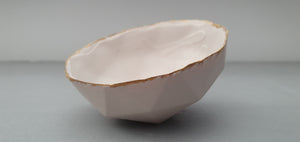 Geometric faceted polyhedron in tan pink bowl made from fine bone china with real mat gold finish - ring dish