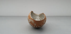 Hand curled big walnut shell in earthy woody colour in stoneware with clear glossy interior