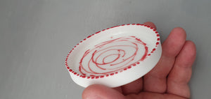 Small stoneware white ring dish in fine bone china with glazed interior and red enamel.