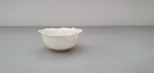 Miniature white vessel with glossy glaze interior made from English fine bone china - one off
