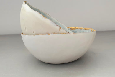 Stoneware Parian porcelain bowl in shades of  grey with mat gold rims mat interior and crystals.