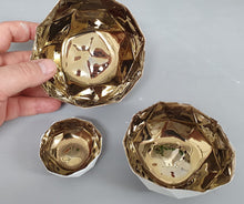 Load image into Gallery viewer, Nesting bowls. Set of 3 geometric faceted polyhedron fine bone china nesting stoneware bowls with gold interior. One of a kind.