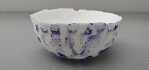 Small snow white vessel with glossy white and blue exterior made from English fine bone china - one of a kind