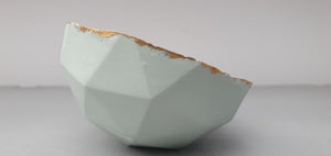 Geometric faceted polyhedron in pale pistachio green bowl made from fine bone china with real mat gold finish - ring dish