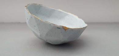 Geometric faceted polyhedron bowl in pastel blue made from stoneware Parian porcelain with real gold finish -  geometric decor