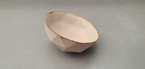 Geometric faceted polyhedron in tan pink bowl made from fine bone china with real mat gold finish - ring dish