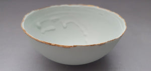 Half price second. Pastel pistachio green porcelain bowl. Stoneware porcelain bowl with gold rims.