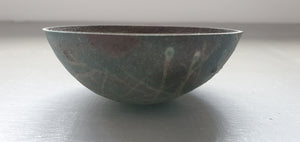 Stoneware small decorative bowl with chocolate black clay and hand drawn exterior pattern.