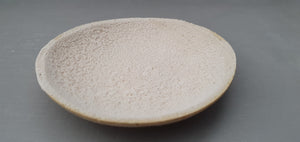 Miniature stoneware dish with a unique textured surface. in light brown clay and dusty pink interior.