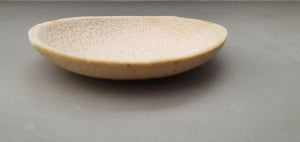 Miniature stoneware dish with a unique textured surface. in light brown clay and dusty pink interior.