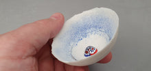Load image into Gallery viewer, Small snow white vessel made from English fine bone china with blue glass dust and venitian millefiori glass- one of a kind