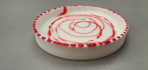 Small stoneware white ring dish in fine bone china with glazed interior and red enamel.