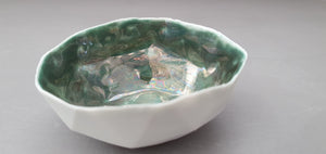 Ring dish. Geometric faceted polyhedron bowl made from white stoneware Parian porcelain with glazed green interior - geometric decor