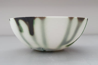 Small decorative bowl. Decorative stoneware English fine bone china small bowl with green and black highlights.