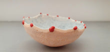 Load image into Gallery viewer, Small peach in colour vessel with serrated rims made from English fine bone china red glass droplets- one off piece