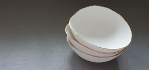 English fine bone china bowl with real gold and little spout lip.