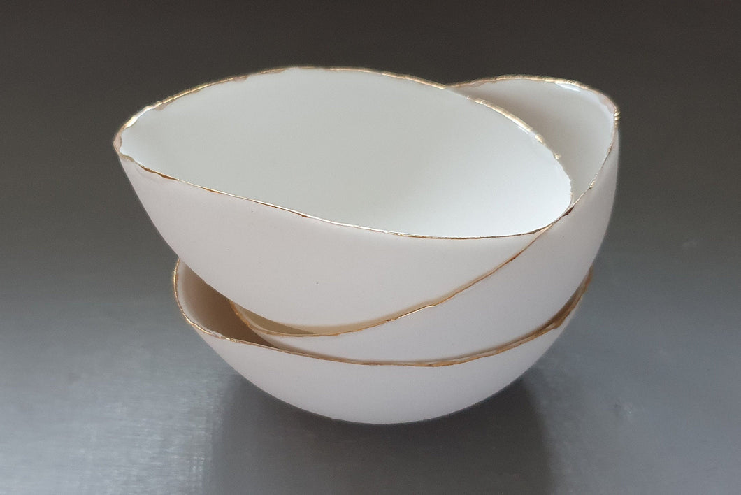 English fine bone china bowl with real gold and little spout lip.