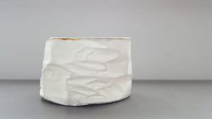 White with gold vessel. Crumpled paper-looking vessel made out of fine bone china with real gold and a hint of turquoise