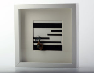 Square white box frame with mixed media. ''Gordian's knot''